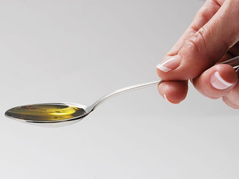 Welltone drips into a spoon